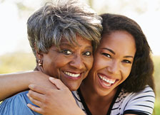 Photo of a mother and daughter smiling for a picture. Link to Life Stage Gift Planner Ages 45-65 Situations.