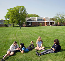 Photo of students sitting on a lawn. Link to Beneficiary Designations.